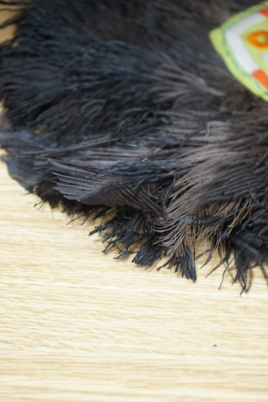 A pair of ostrich feather fans, with embroidered central panels, 45cm high. Condition - good